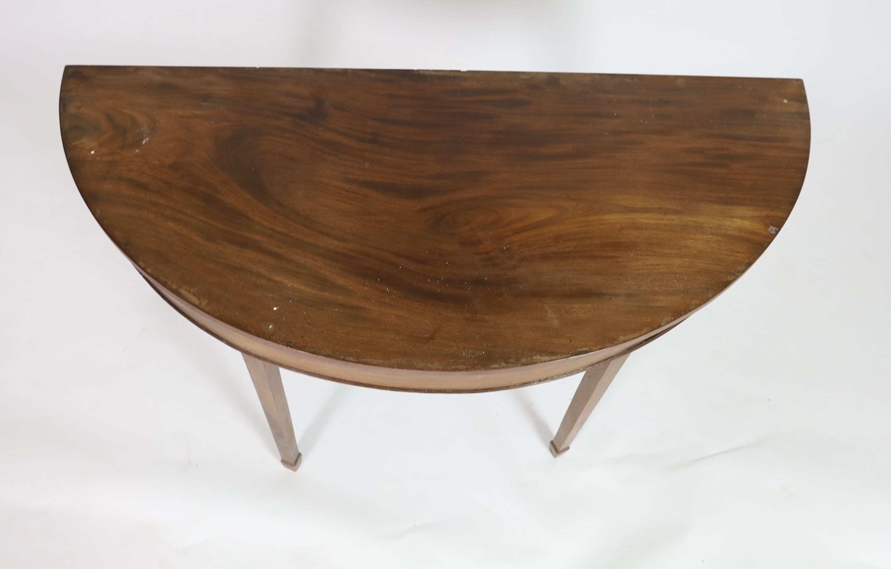 A George III mahogany D shaped table, 138cm wide